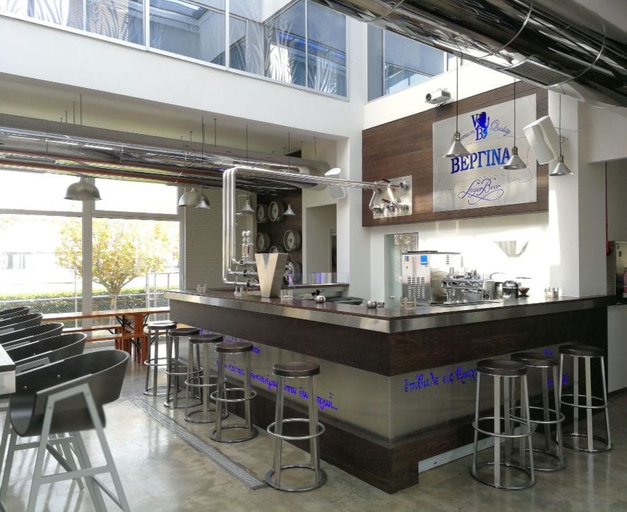 'Vergina Beer' tasting room with a bar' table and chairs